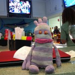The seedy airport bar - sock monkey is getting tired.